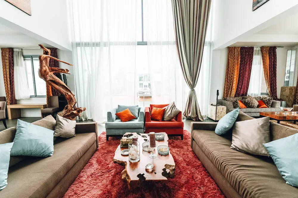Sitting room with sofas and a red rug